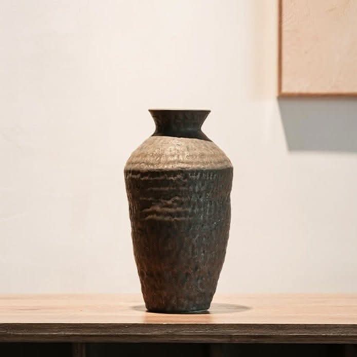 Abstract geometric ceramic vase with hammered texture in earthy tones. Home Decor.
